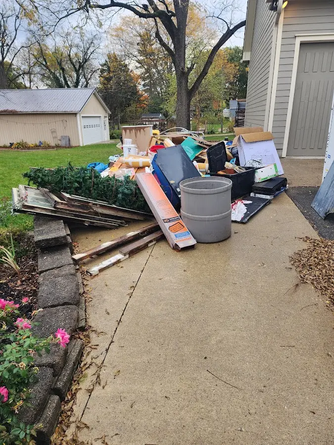 Dumpster being loaded with debris for Roofing Dumpster Rental in Shamokin